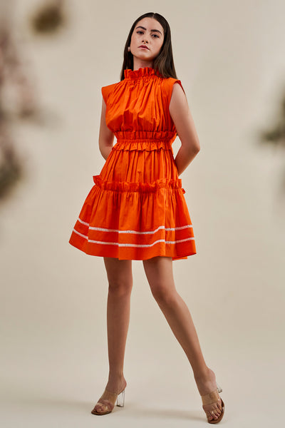 Orange pleated dress with lace hem