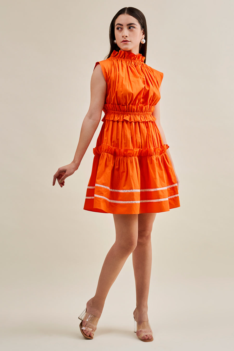 Orange pleated dress with lace hem